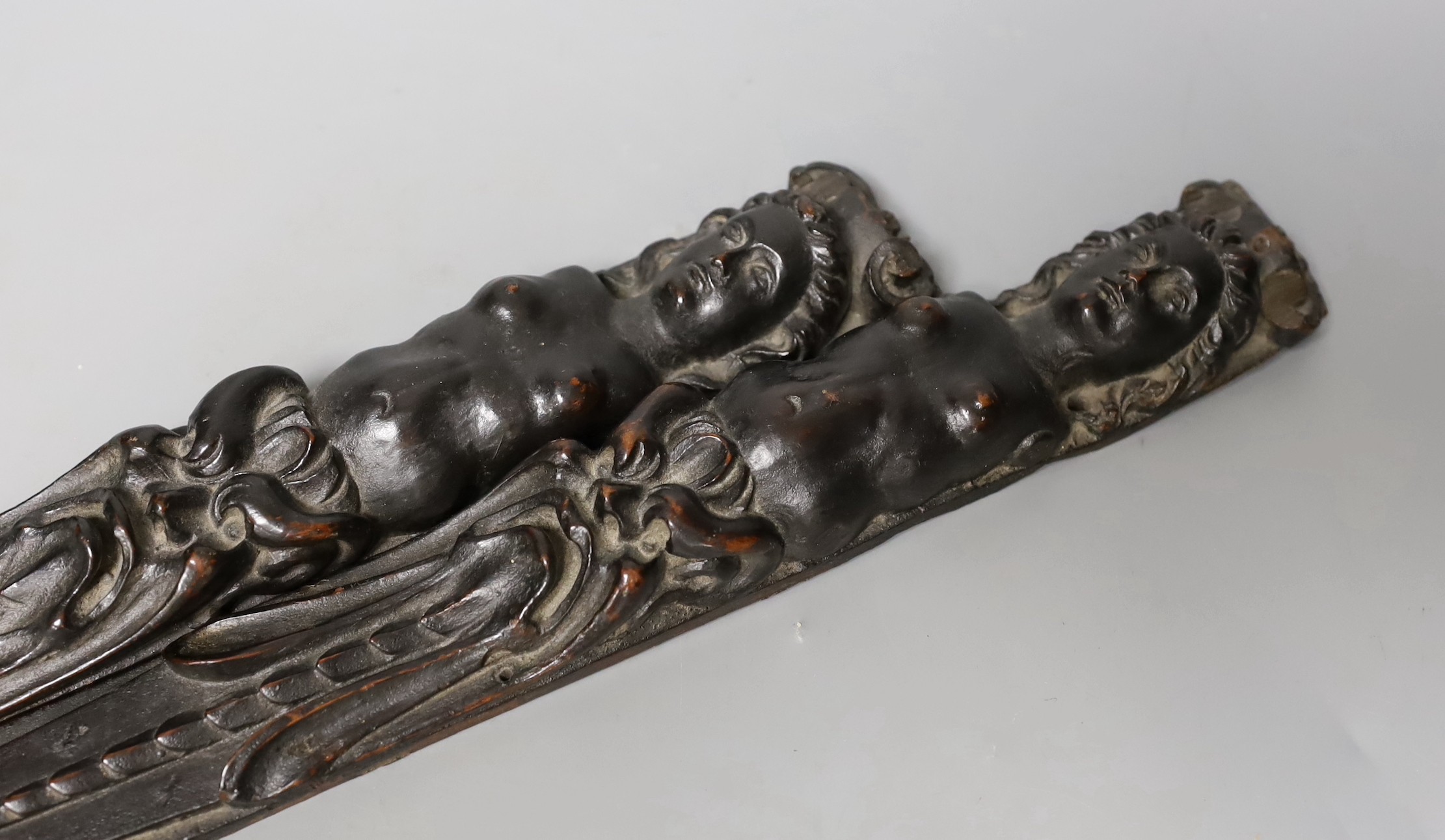 A pair of 18th century French carved walnut appliques, 39.5 cms long